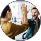 Some colleagues high-five to celebrate a success